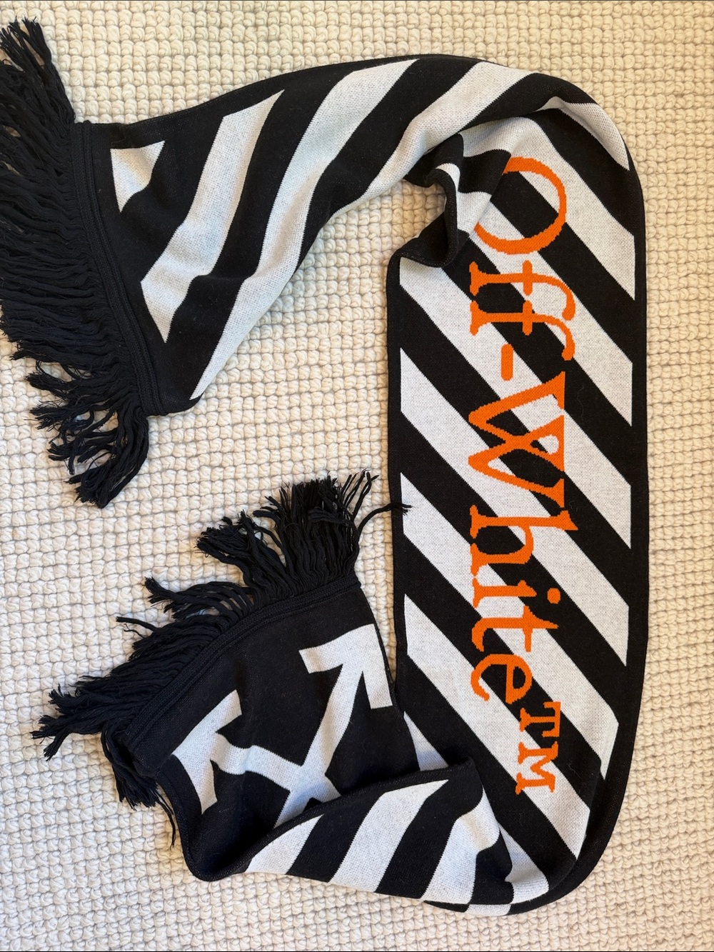 OFF-WHITE black and cream fringe striped scarf with orange logo.